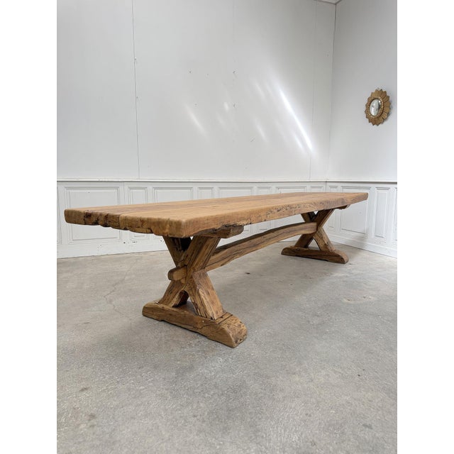 A very large wooden table with a superb patina, dating from the 1950s and reminiscent of a monastery table. The beauty of...