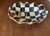 Signature gold luster accented rippled edge