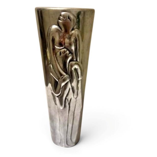 Striking vase from the “Acrobat” collection by Carrol Boyes. This piece blends functional decor and sculptural metalwork....