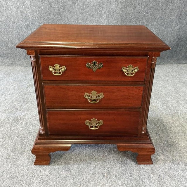 This vintage American Drew American Independence Collection nightstand features a warm traditional finish, classic brass...