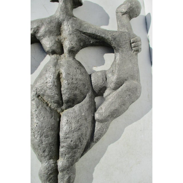 Cast lead bas-relief figure of the Earth Mother and on each side the Male and the female push out from her sides. The...