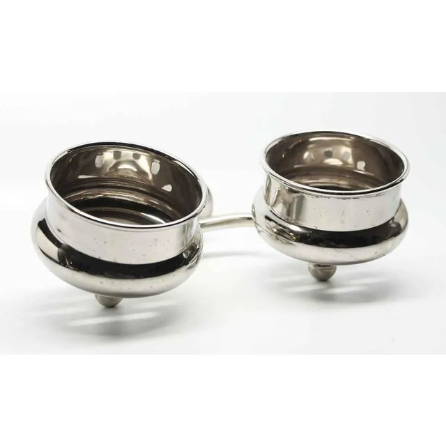 Introducing an Olde New double arm wall mount cup holder, meticulously crafted to replicate a 19th-century design....