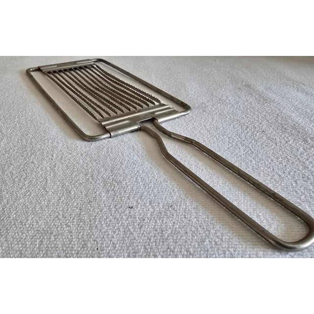 Description: Made in Japan Metal slicer Works for any soft fruits, tomatoes, hard boiled eggs Perfect slices Made of metal...