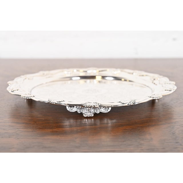 A gorgeous antique Victorian sterling silver footed serving tray or plate By Tiffany & Co. (signed to the underside) USA,...