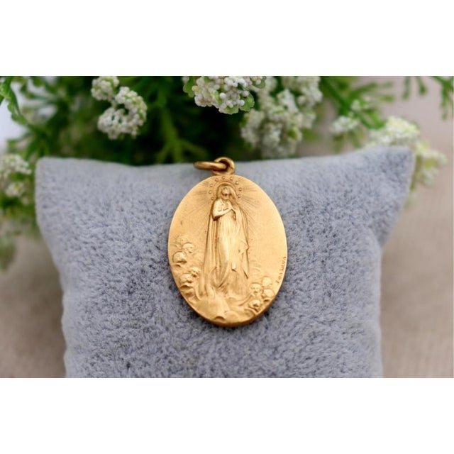 19.2k Gold Our Lady of the Immaculate Conception Pendant, in Worn conditions. Designed 1920 to 1949