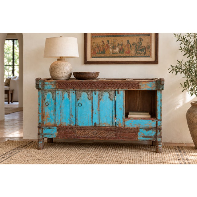 Years of wear have turned the original paint on this Damachiya chest into patches of turquoise, rust and bare wood. A band...