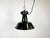 Industrial black enamel pendant light made in former Czechoslovakia during the 1960s. White enamel inside the shade. Cast...
