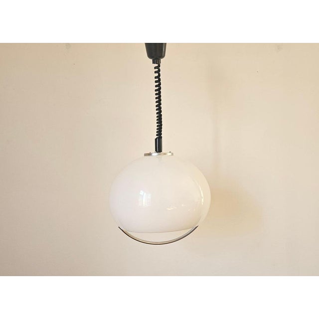 Rare type. Marked by label. Very nice style of lighting. Space age. This piece is attributed to the mentioned...