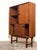 A 1960s Italian-made highboard bookcase. The piece is produced by Boravero, Turin, and is made of solid wood with teak...