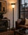 Black & Gold Neoclassical Torchiere Floor Lamp with Frosted Fluted Shade A dramatic neoclassical torchiere floor lamp...