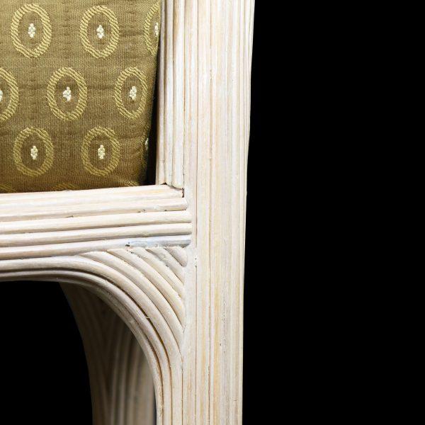 A set of four dining chairs in blonde pencil reed with striking geometric frames. The graphic silhouettes and honey-blonde...