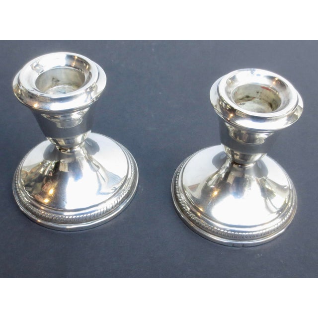 Mid-century weighted sterling silver candlesticks. No maker's name, marked sterling. The measurements are 3.25" in...