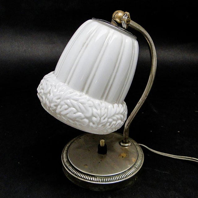 Night light from the 50s. It has a glass shade and a metal metal mount and a glass base. It is preserved in very good...