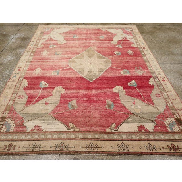 A vintage Turkish Anatolian small room size carpet handmade during the Mid-20th Century. Measures: 8' 4" x 10' 11".