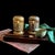 Pair of vintage brass Chinese immortal lanterns featuring intricate pierced figural scenes with scholars and bamboo...