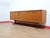 A stunning sideboard made by renowned British furniture maker Austinsuite, this Mid Century Modern Vintage Teak Credenza...