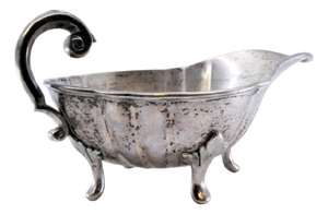 Silver Gravy Boat Resting on Four Feet