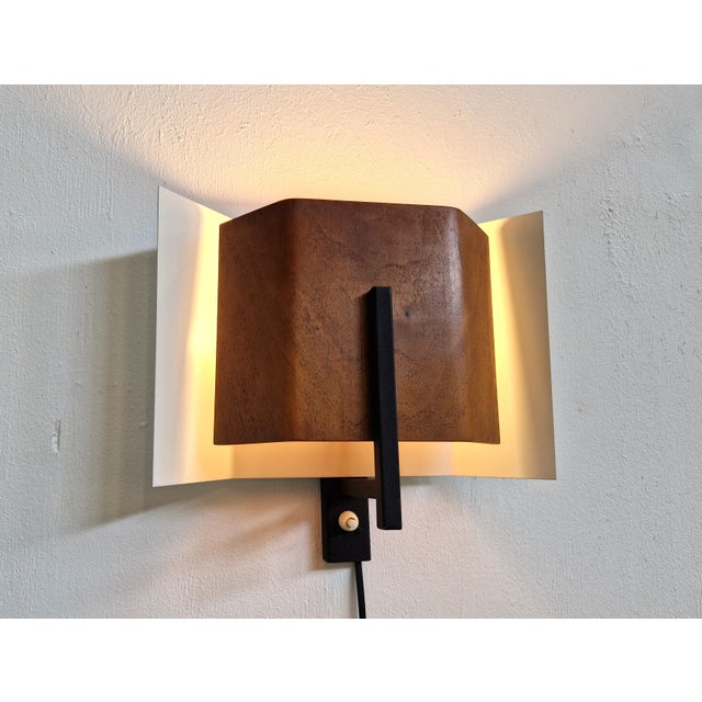 Very rare wall light in plywood and metal, made by Philips in the early 1960s. This could possibly be a design by Louis...