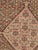 An antique Persian Senneh flatwoven rug from Kurdistan in western Iran, featuring a finely detailed Herati design across a...