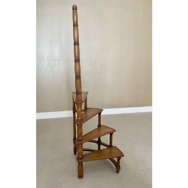 Elegant antique spiral library steps crafted from solid wood and stamped “Made in Italy.” This freestanding bibliothèque...