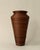A vintage 1970's handcrafted pencil reed floor vase in a classic amphora form and a finish that shifts from warm honey to...
