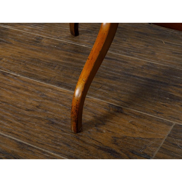 An English Regency period fruitwood guéridon side table from the 19th century with pierced brass three-quarter gallery,...