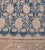 This Malayer rug has a deep indigo-blue field with an overall design of linked buff-brown angular vine linking floral...