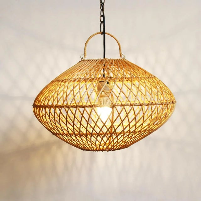 Hand woven natural rattan orb / saucer shape pendant lantern in small size. Each is handmade and may vary slightly in...