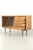 Extraordinary, Typical 50s Style, Blond Veneer Sideboard with Display. This dresser has elegant wooden legs with brass...