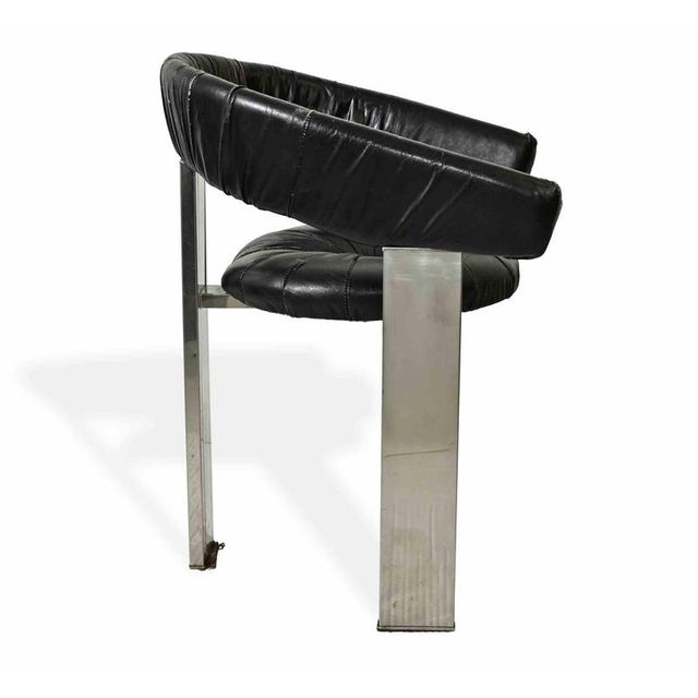 A striking set of six dining chairs in the style of Eckart Muthesius, produced in the 1970s. The design exemplifies the...