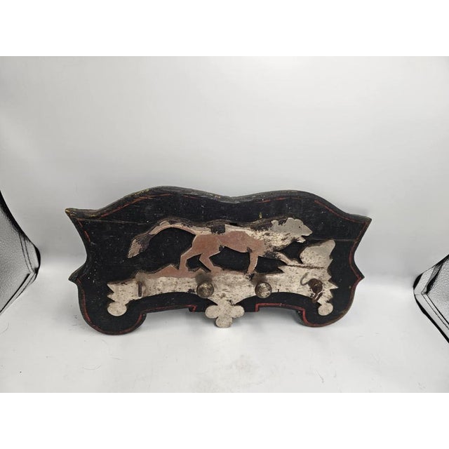 Pre-war coat hanger, dog, nickel-plated on wood, dimensions: height 18 cm, width 35.5 cm, depth 3.5 cm.