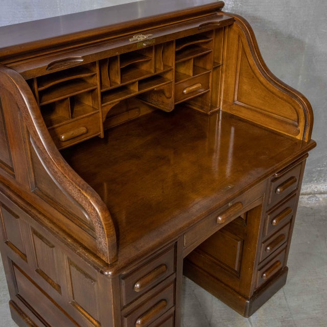 A super quality, unusually small walnut roll top desk from the Victorian/Edwardian period. All the outer panelling is...