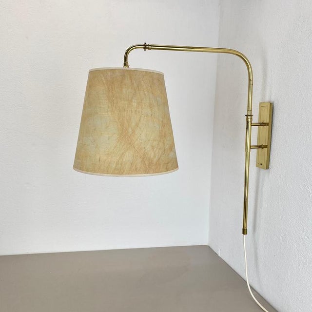 Article: adjustable Wall light with shade Origin: Italy Decade: 1950s This wall light was designed and produced in Italy...