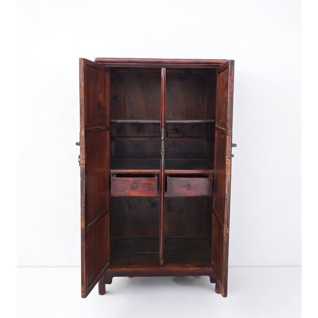 This 19th century armoire cabinet is built of solid catalpa wood using traditional Chinese joinery of tenon and mortise....