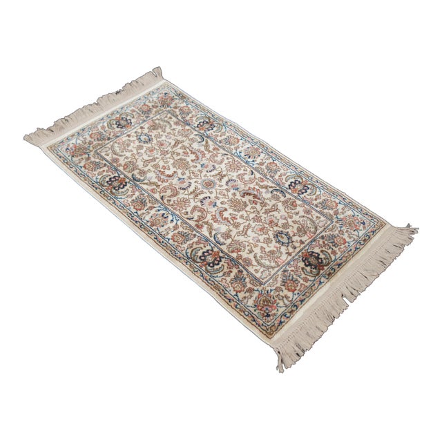 Vintage Karastan 100% wool area rug / mat / carpet featuring a floral motif inspired by palmettes and scrolled vines with...
