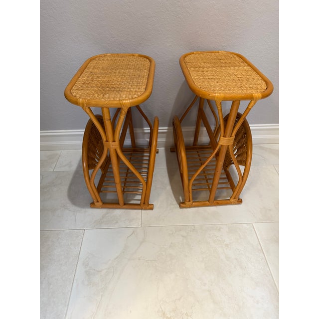 A unique pair of 1970s Rattan Mid-Century Modern Side Bedside End Sofa Table Magazine Rack. These vintage tables are 23...