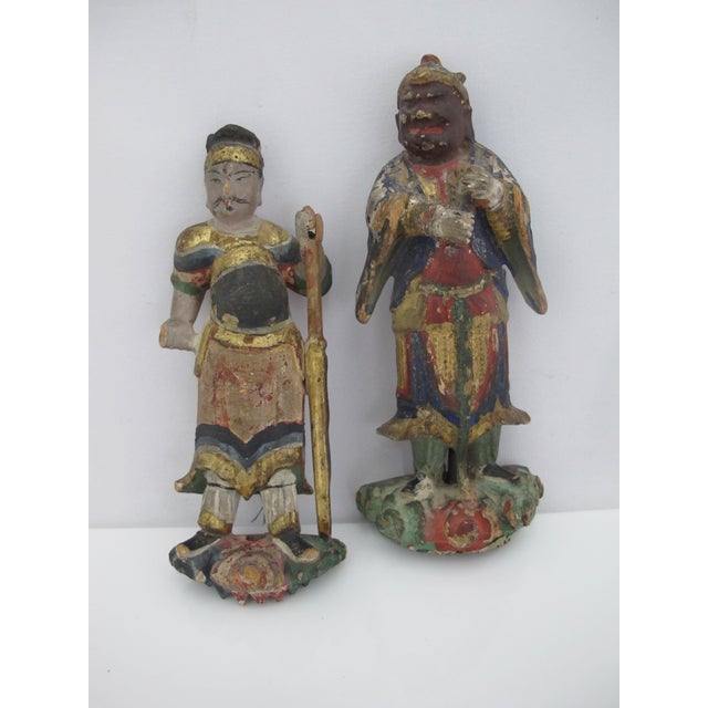 Pair of antique Chinese carved wood polychrome figurines with gilt accents. Do not stand upright. One measures 6 1/4" tall...
