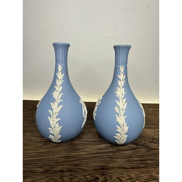 Elegant and timeless, this beautiful pair of vintage Wedgwood blue Jasperware bud vases feature the classic Spring/Summer...