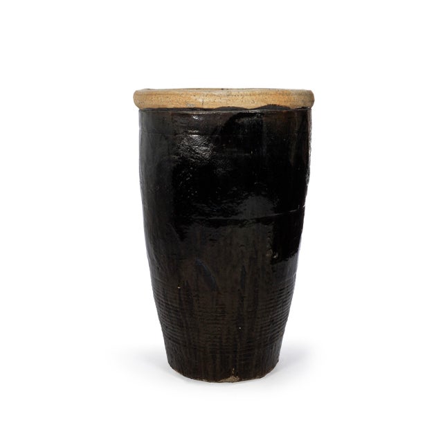 Tall glazed storage jar. May vary in color, size, and detail