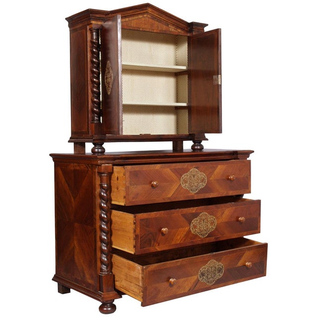 An important and highly decorative central european baroque cabinet-on-chest, dating from the first decades of the 18th...