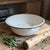 Elevate your farmhouse or cottage aesthetic with this exceptional antique white enamelware wash basin. Featuring a...