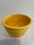 A vintage Fiesta #3 mixing bowl in the classic yellow glaze, featuring concentric ring detailing and a rolled rim. This...