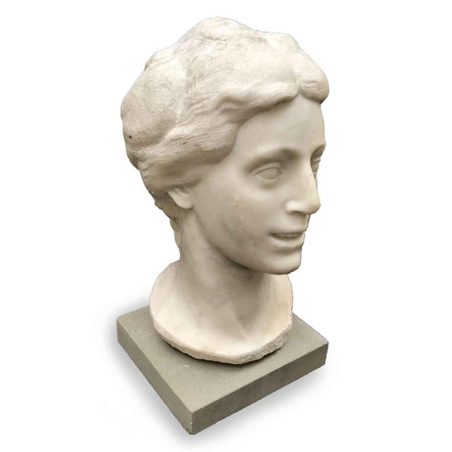 Aurelio Bossi, Bust of a Woman in White Marble, signed at the base on the front, with a modern pietra serena pedestal. The...