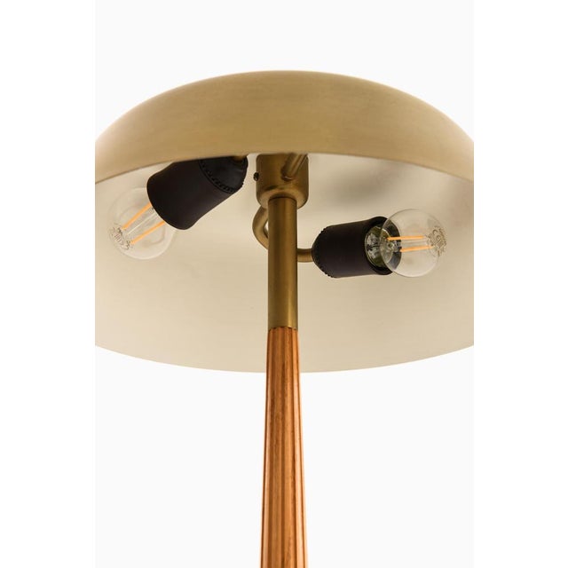 The table lamp model 15474, designed by harald notini and produced by arvid böhlmarks lampfabrik in sweden during the...