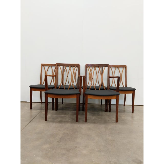 Set of 6 authentic vintage mid century modern dining chairs. 2 armchairs and 4 side chairs. By G Plan. Maker's label on...