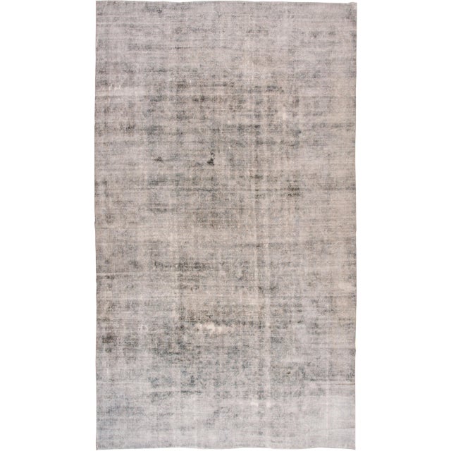 Early 20th Century Distressed Antique Persian Kerman Wool Rug For Sale