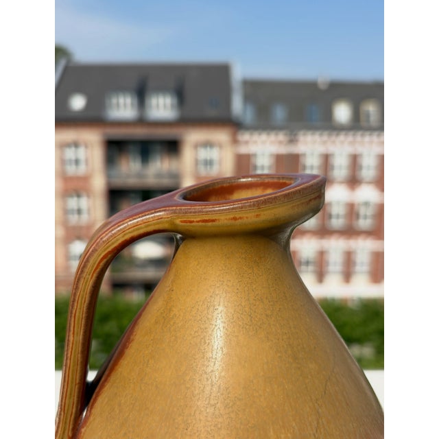 Glazed stoneware jug by Gunnar Nylund for Rörstrand, dating to the 1940s. Well preserved overall, with a few small chips,...
