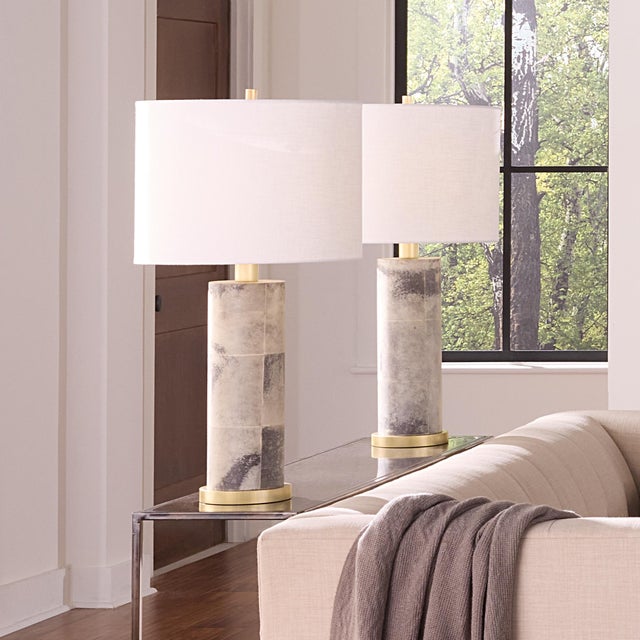 Rivet Table Lamp, Grey Vellum Natural, pierced goat vellum wraps around the base of this classic table lamp, elevating its...