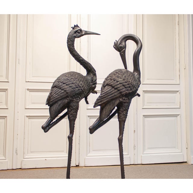 Impressive pair of large decorative crane sculptures, made in Sweden during the 1970s and executed in patinated bronze....