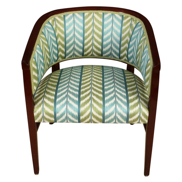 A pair of newly upholstered polished mahogany tub chairs in Quadrille blue and green chevron fabric. Contemporary and...